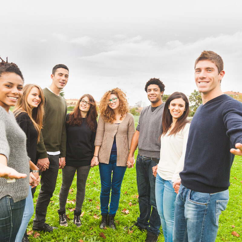 Multiethnic Group of Friends Giving a Hand